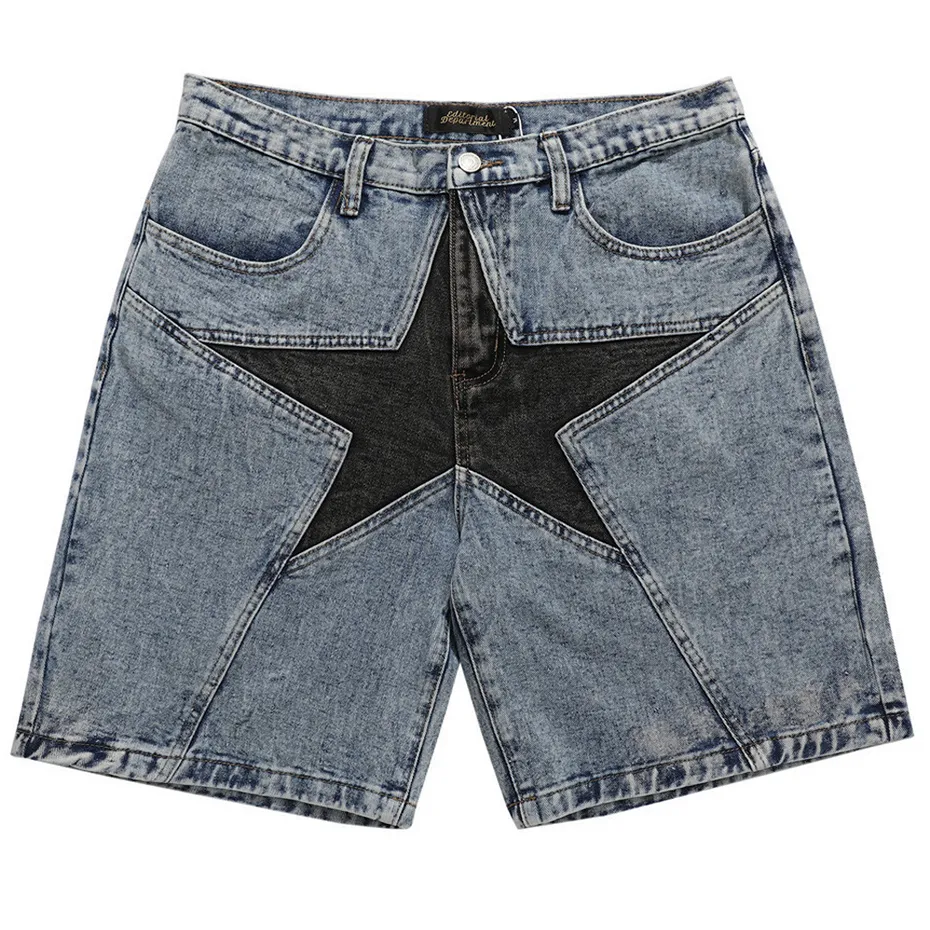 Washed blue baggy denim shorts with a large black star patchwork panel shown from the front.