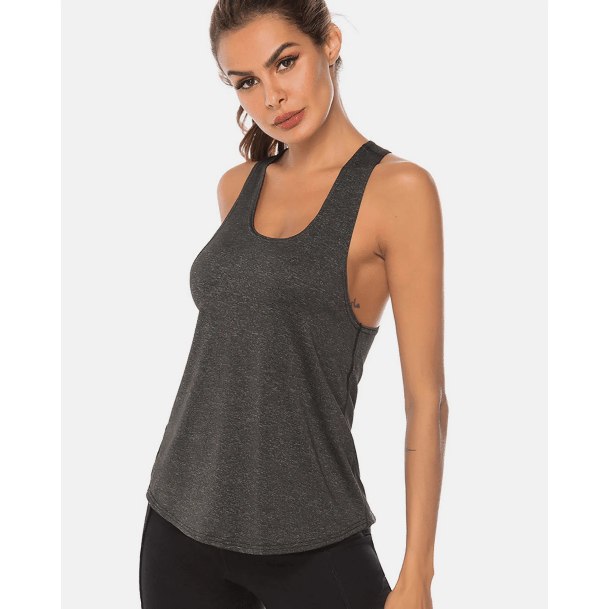 Model wearing a charcoal scoop-neck workout tank top in an angled front pose.