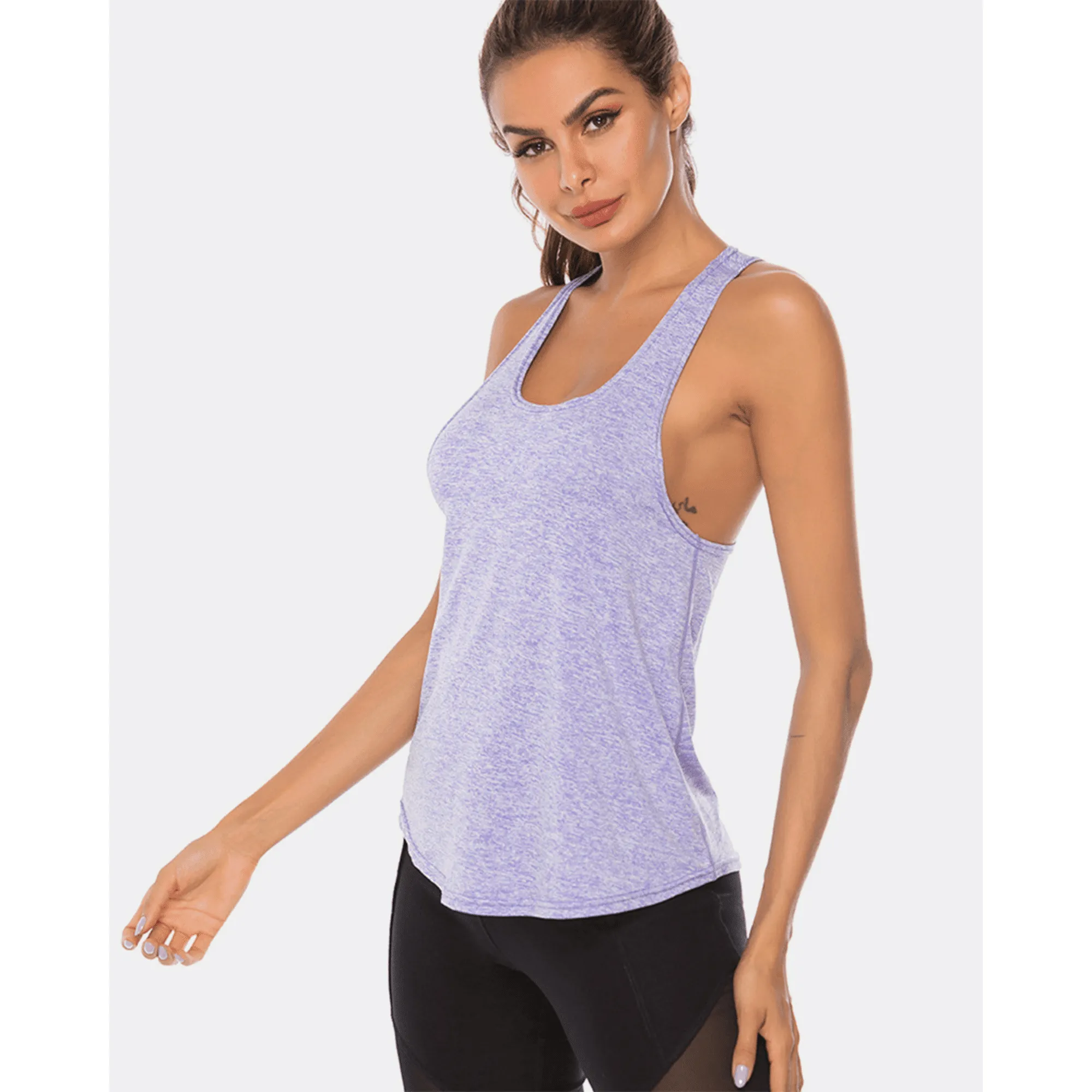 Angled front view of a model wearing a lavender scoop-neck workout tank top.